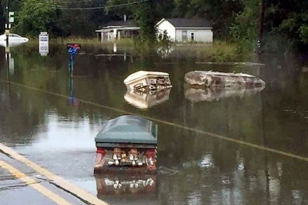 Coffins float down street as devastating Louisiana floods uproot caskets from graveyard