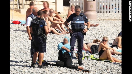 Burkini ban: Police in Nice force woman to remove part of clothing