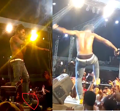 VIDEO | Angry Burna Boy almost attack fan who untied and allegedly took one of shoes while performing at Phyno’s concert
