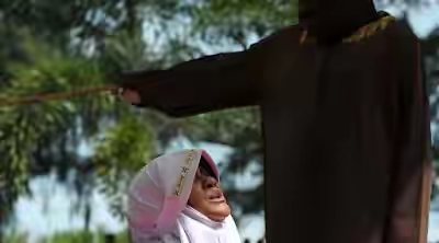 Woman flogged 7 times for standing too close to man in Aceh, Indonesia