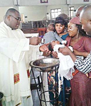 Catholic Church baptises 13 infants