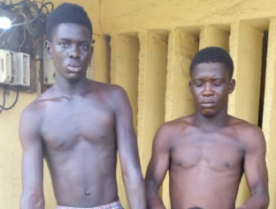 Graphic Photos: Two brothers arrested with the head of their neighbour they beheaded for ritual