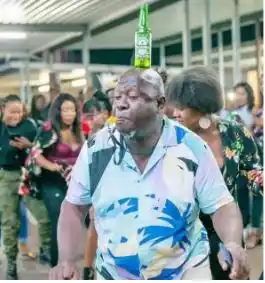 Viral video of a man dancing with a bottle on his head is all you need to watch today